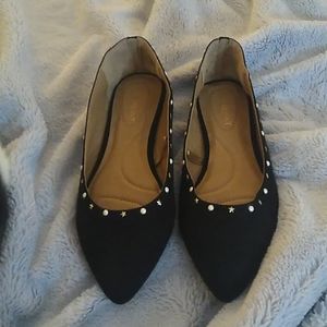 Black flats with little stars, and dots, never been worn.